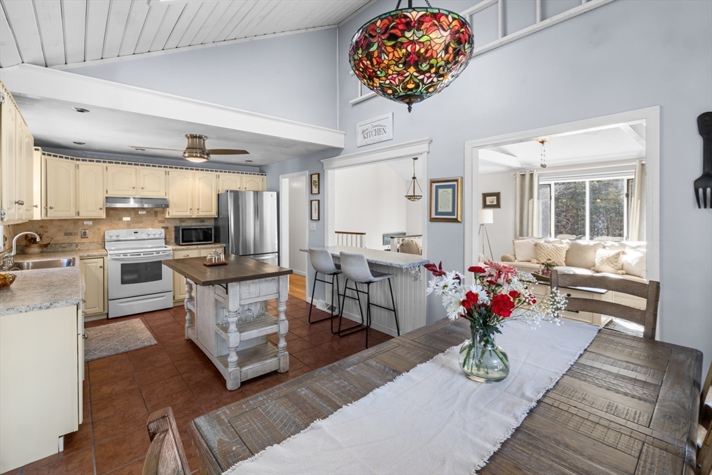 7 Carol Road Wareham, MA 02532 - Photo 15 of 42 a living room with furniture and a chandelier