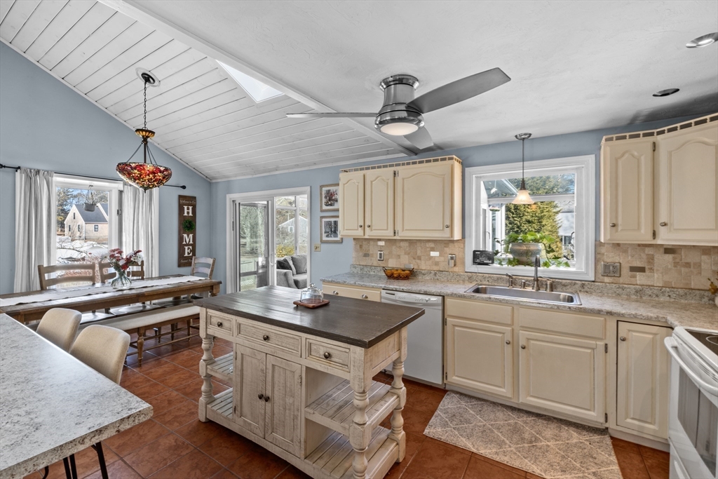 7 Carol Road Wareham, MA 02532 - Photo 17 of 42 a kitchen with a sink stove and cabinets