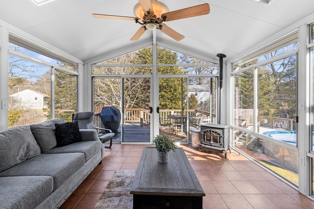 7 Carol Road Wareham, MA 02532 - Photo 19 of 42 a living room with furniture a chandelier and a large window