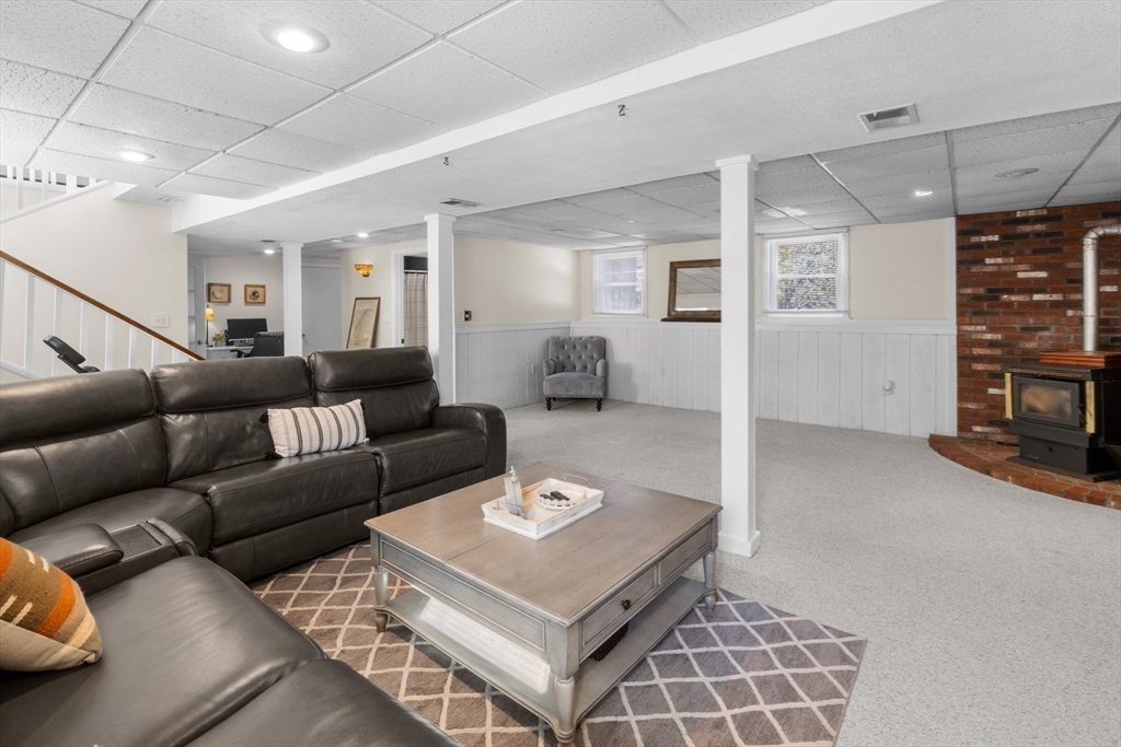 7 Carol Road Wareham, MA 02532 - Photo 32 of 42 a living room with furniture a ceiling fan and a rug