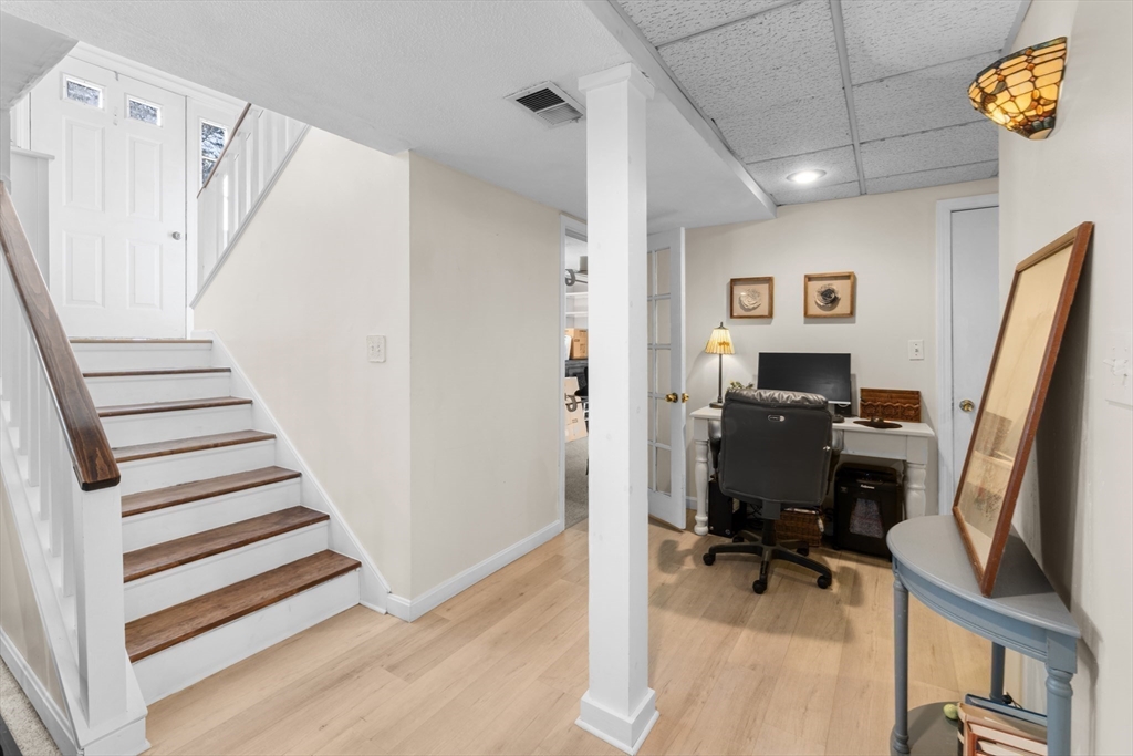7 Carol Road Wareham, MA 02532 - Photo 34 of 42 a view of a workspace with wooden floor and white walls