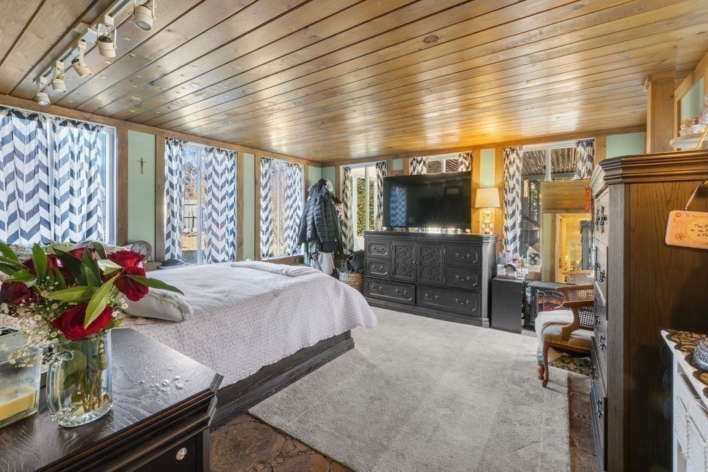 7 Carol Road Wareham, MA 02532 - Photo 37 of 42 a bed room with a bed and a television