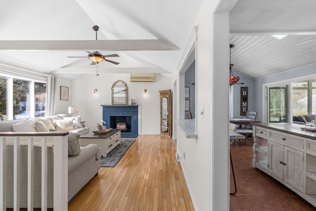 7 Carol Road Wareham, MA 02532 - Photo 10 of 42 a living room with furniture a fireplace and a chandelier