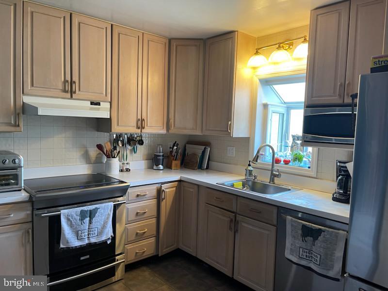 3223 Ascot Lane Fallston, MD 21047 - Photo 4 of 12 a kitchen with stainless steel appliances granite countertop a sink a stove and cabinets