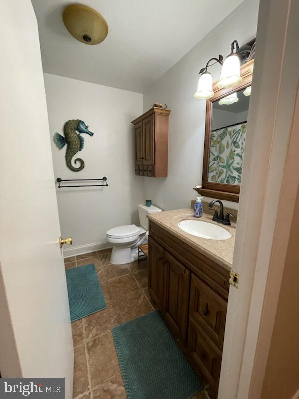 3223 Ascot Lane Fallston, MD 21047 - Photo 7 of 12 a bathroom with a sink a toilet and mirror