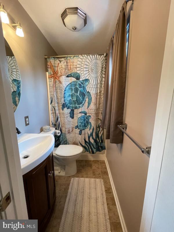 3223 Ascot Lane Fallston, MD 21047 - Photo 8 of 12 a bathroom with a sink a toilet a mirror and tub