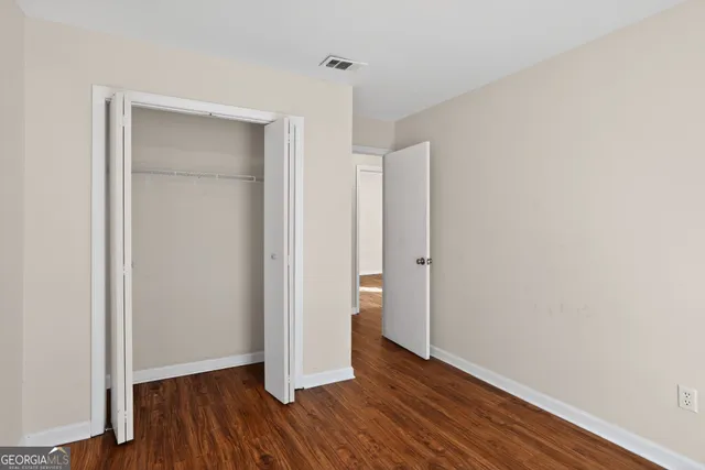 a view of hallway with wooden floor