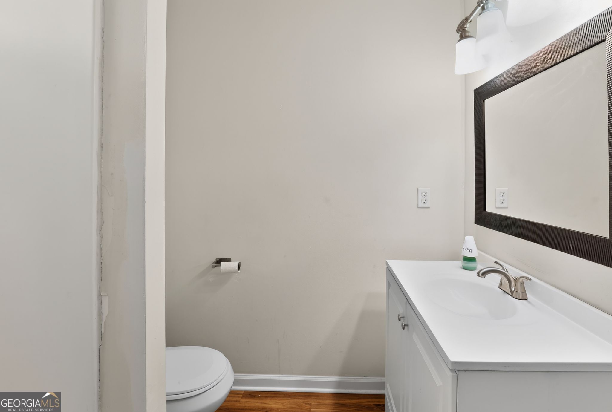 2764 Davis Mill Road Hephzibah, GA 30815 - Photo 23 of 29 a bathroom with a sink a toilet and shower