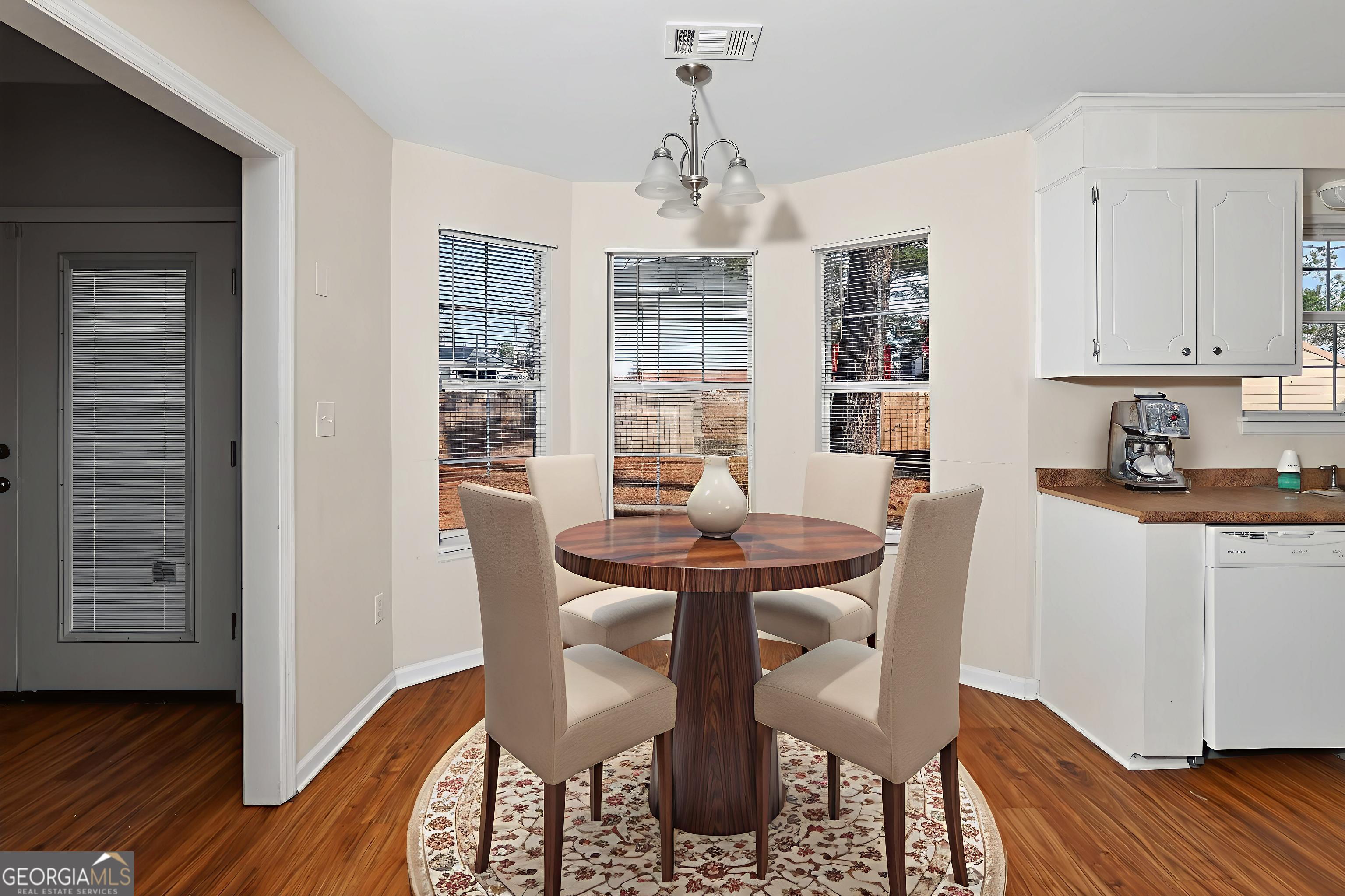 2764 Davis Mill Road Hephzibah, GA 30815 - Photo 8 of 29 a view of a dining room with furniture window and wooden floor