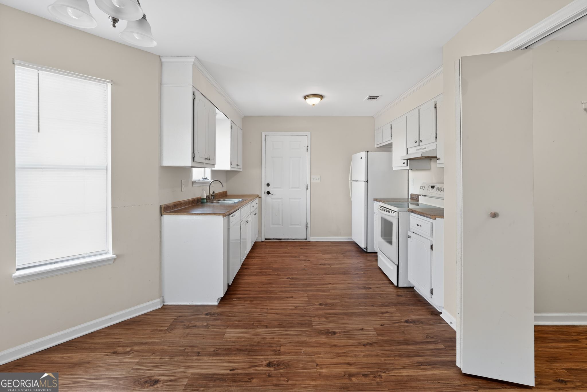 2764 Davis Mill Road Hephzibah, GA 30815 - Photo 10 of 29 a kitchen with stainless steel appliances a refrigerator and a stove top oven