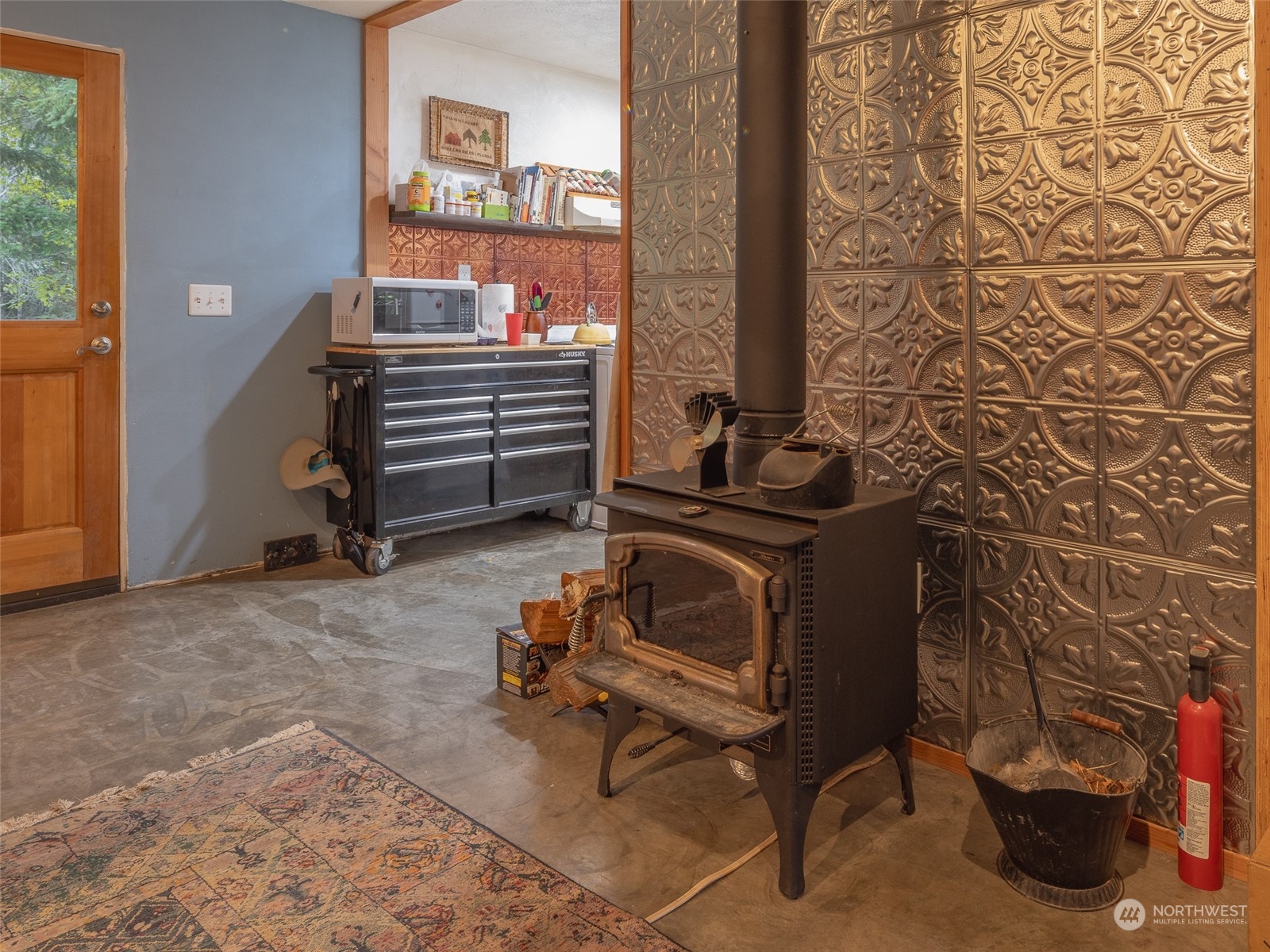 1395 Little Quil Road Quilcene, WA 98376 - Photo 11 of 39 a room with furniture and a gate
