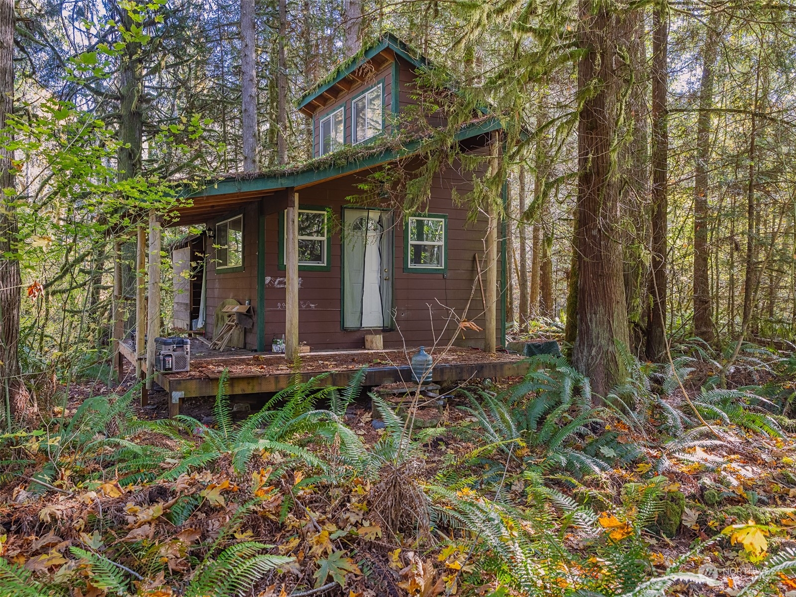 1395 Little Quil Road Quilcene, WA 98376 - Photo 29 of 39 a front view of a house with garden