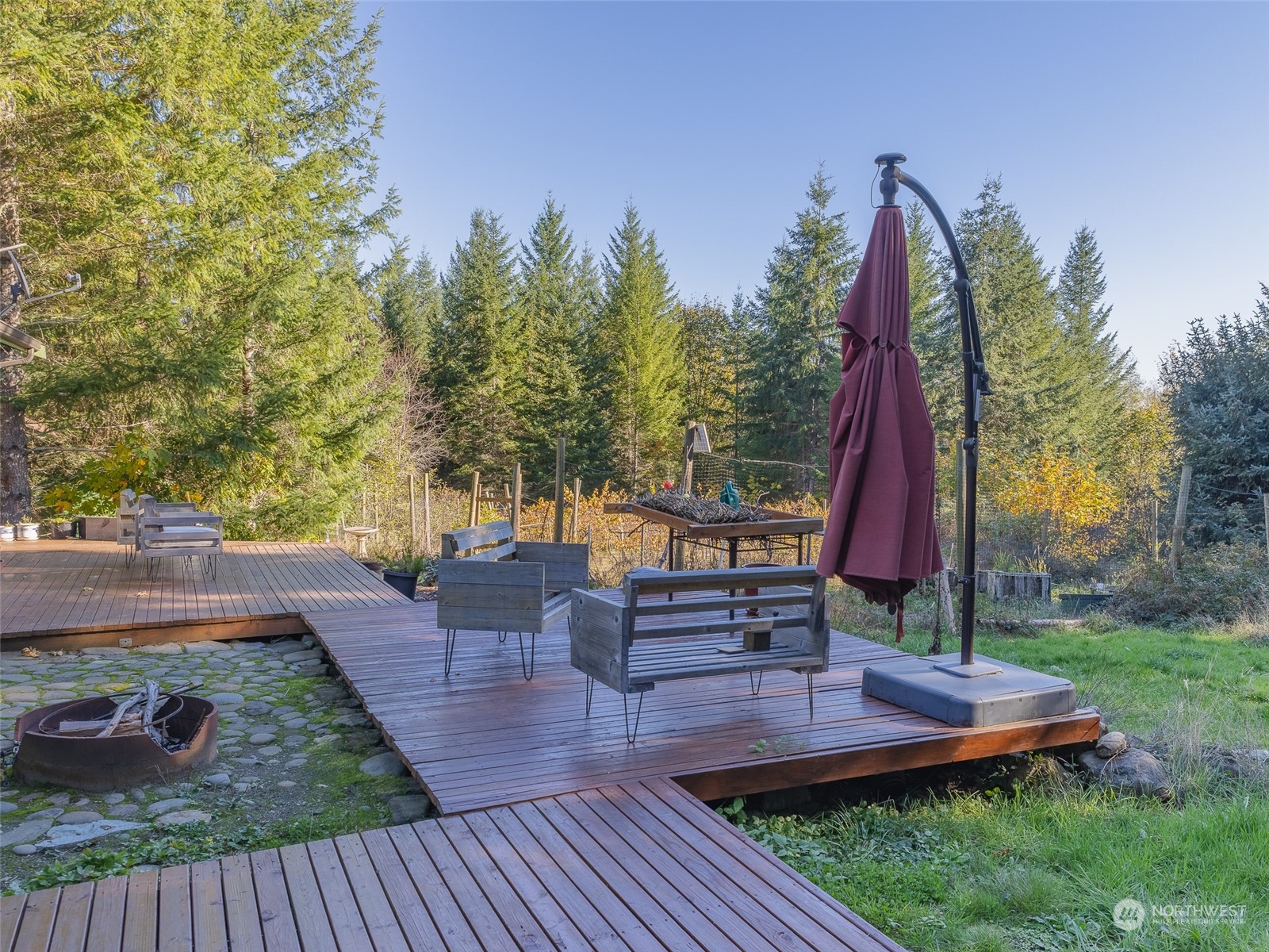1395 Little Quil Road Quilcene, WA 98376 - Photo 33 of 39 a view of a house with backyard and sitting area