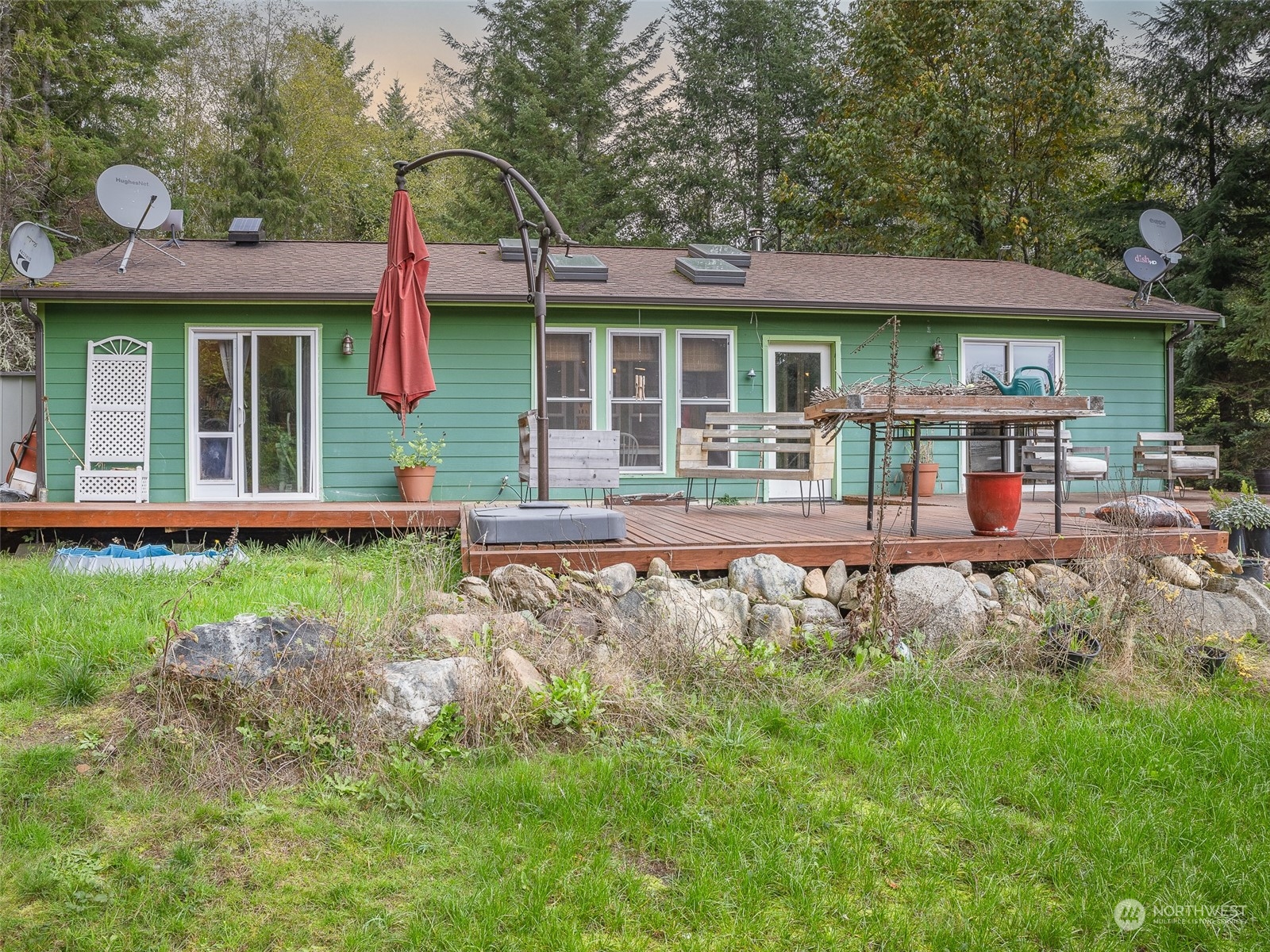 1395 Little Quil Road Quilcene, WA 98376 - Photo 5 of 39 a front view of a house with garden