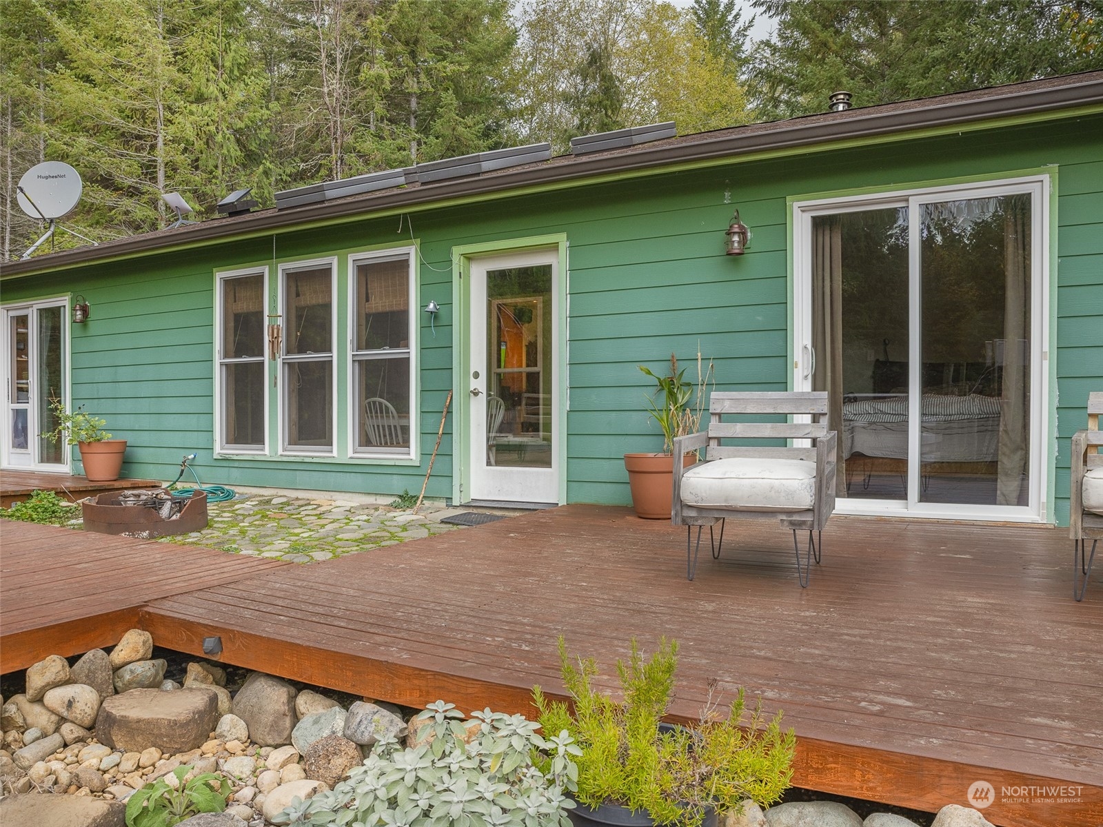 1395 Little Quil Road Quilcene, WA 98376 - Photo 6 of 39 a backyard of a house with outdoor seating