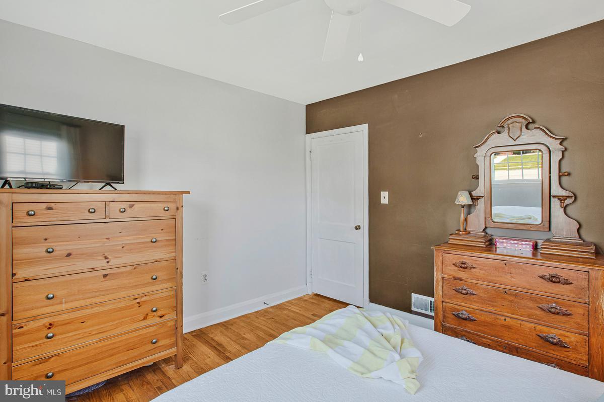 601 Forest View Road Linthicum Heights, MD 21090 - Photo 22 of 37 a bedroom with a bed and mirror