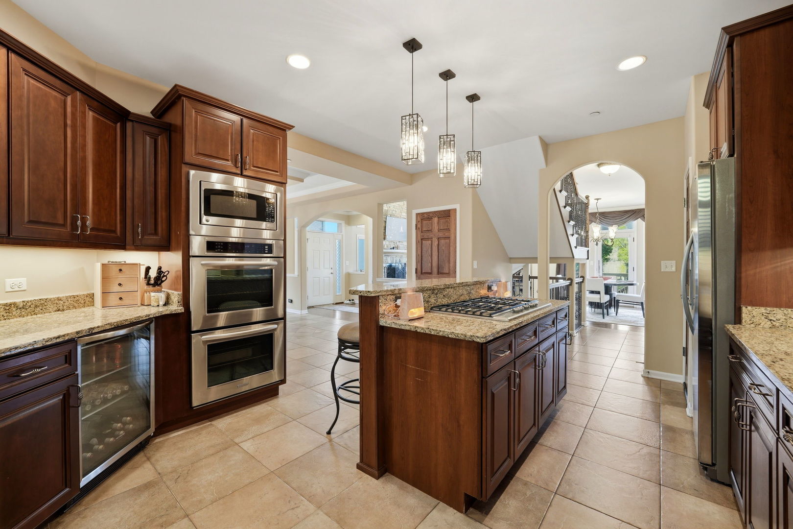 1406 Rue Paris Place Inverness, IL 60067 - Photo 15 of 35 a kitchen with granite countertop a stove oven and sink