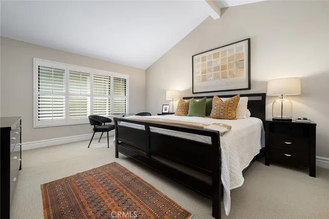 a bedroom with a bed and cabinet