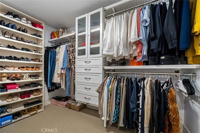 a bedroom with a bed chair and a window