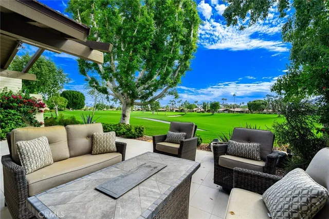 a front view of house with green space and porch