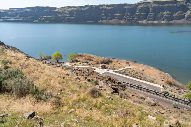 a view of a road with an ocean view