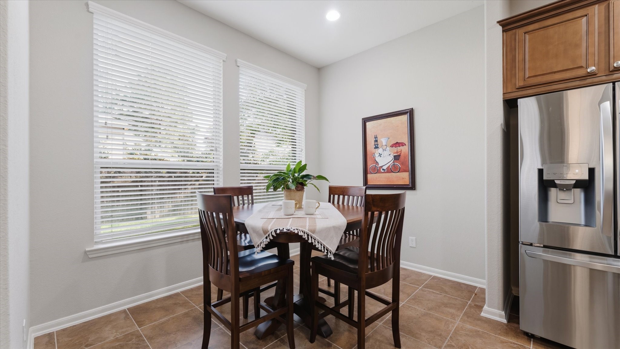 14 Painted Post Place Spring, TX 77389 - Photo 19 of 43 a view of a dining room with furniture window and wooden floor