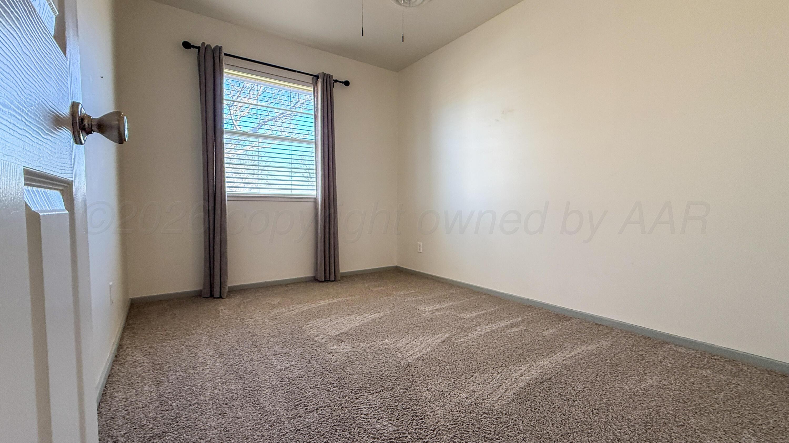 1409 Maple Avenue Panhandle, TX 79068 - Photo 14 of 16 an empty room with windows