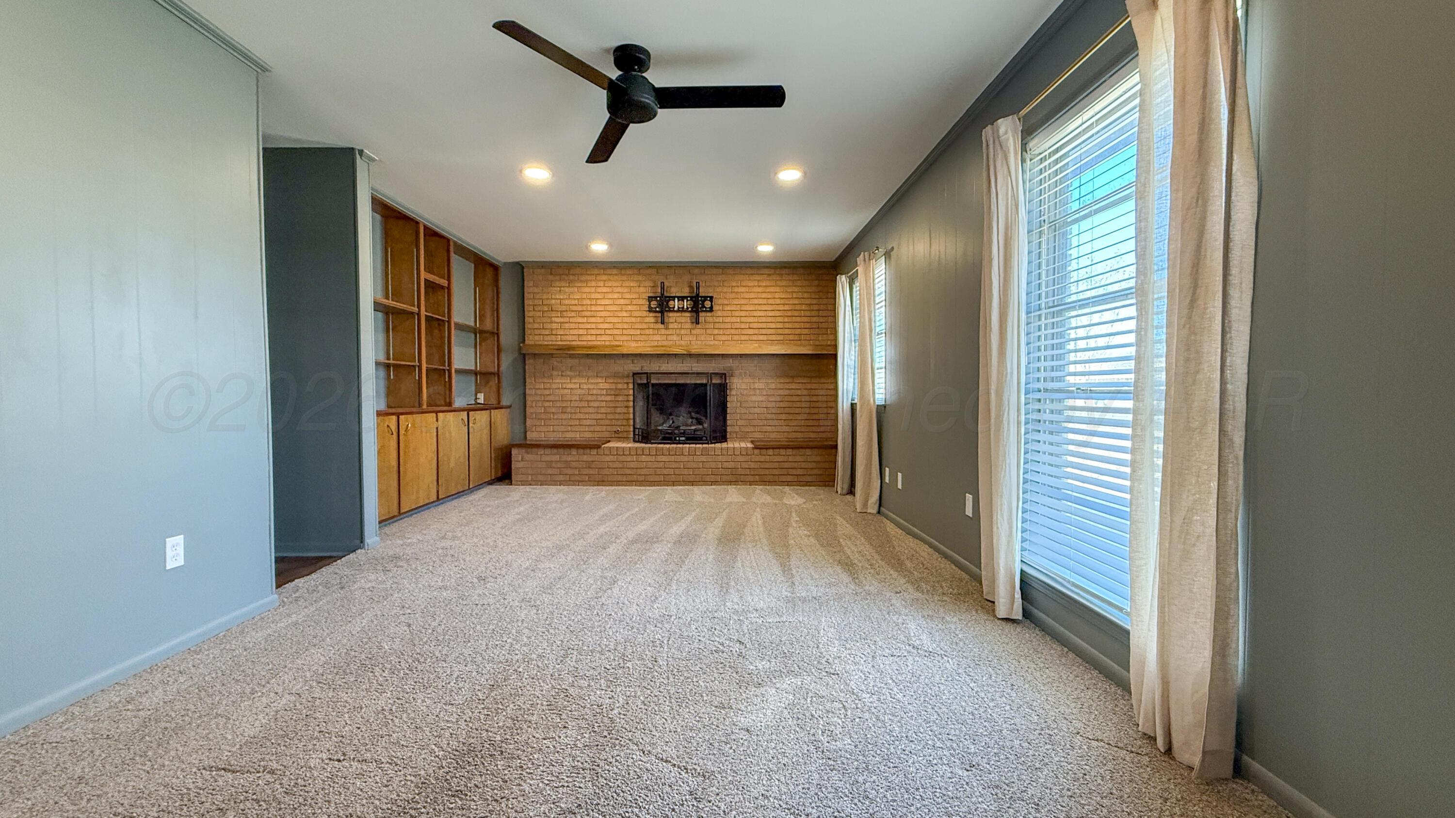1409 Maple Avenue Panhandle, TX 79068 - Photo 4 of 16 a view of empty room with a windows and kitchen view