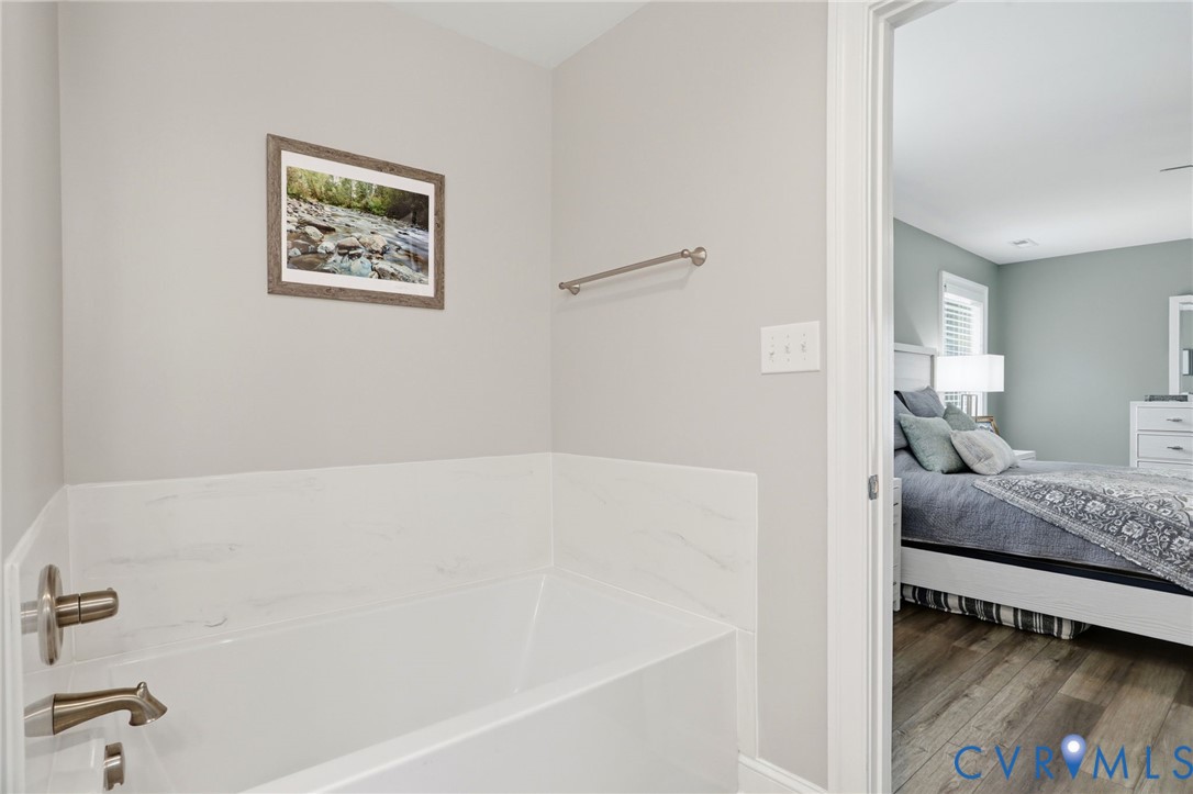 12040 Kenton Ridge Road Ashland, VA 23005 - Photo 38 of 54 White bathtub featuring brushed nickel fixtures an