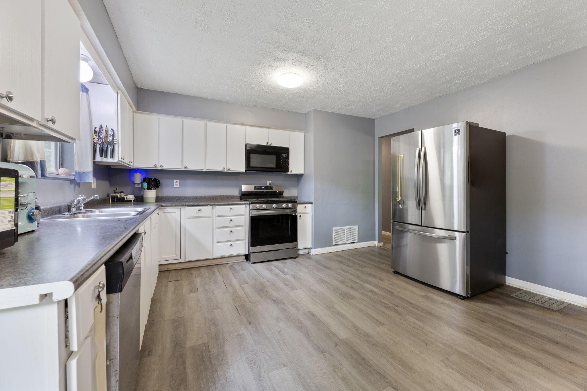 76 Harrison Street Pataskala, OH 43068 - Photo 17 of 45 Large, country kitchen with ss appliances