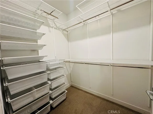 a view of an empty walk in closet