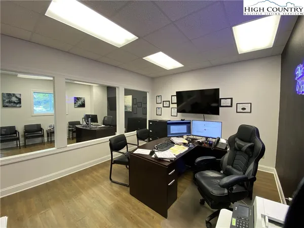 a room with furniture and a flat screen tv