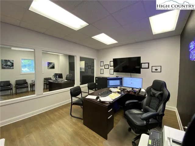 a room with furniture and a flat screen tv