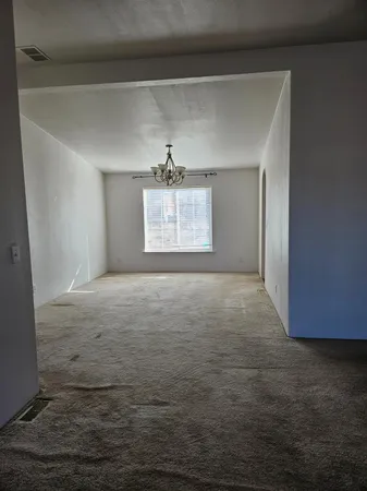 a large kitchen with stainless steel appliances granite countertop a stove and a sink
