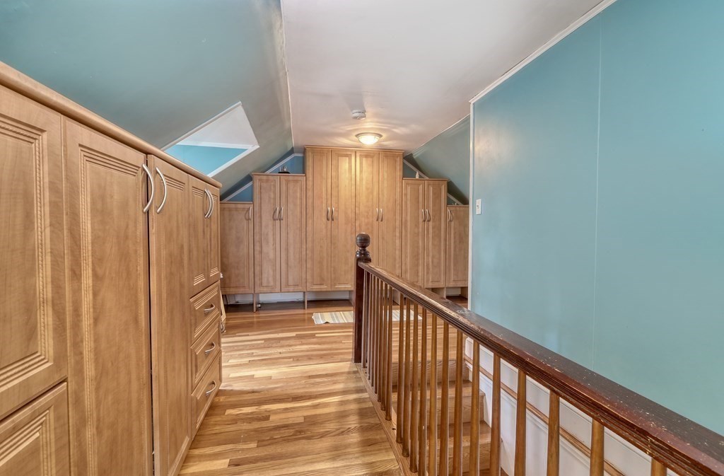 3 Oak Tree Road Dedham, MA 02026 - Photo 14 of 23 a view of a hallway with wooden floor and staircase