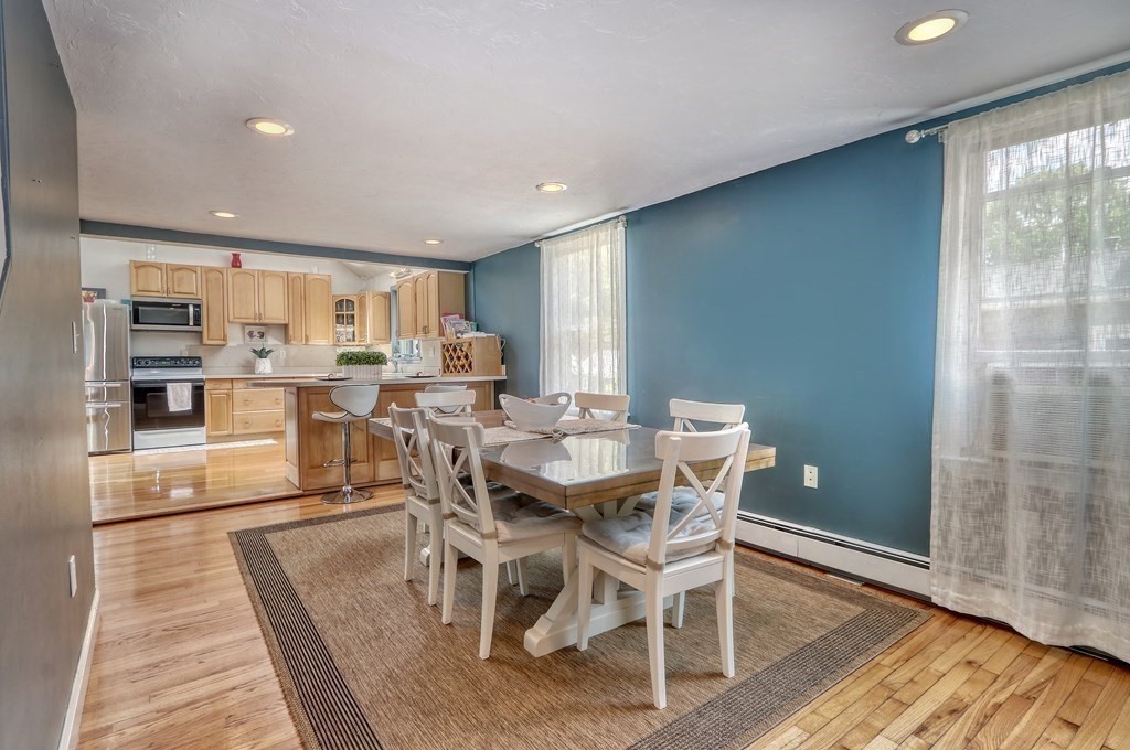 3 Oak Tree Road Dedham, MA 02026 - Photo 6 of 23 a view of a dining room with furniture window and wooden floor