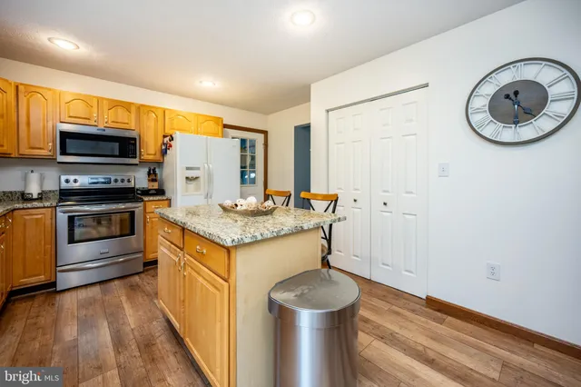 a kitchen with a sink and a stove top oven