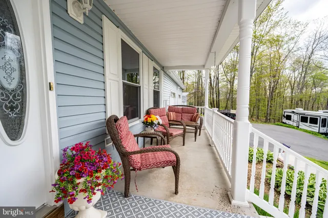 a outdoor living space with furniture and garden view