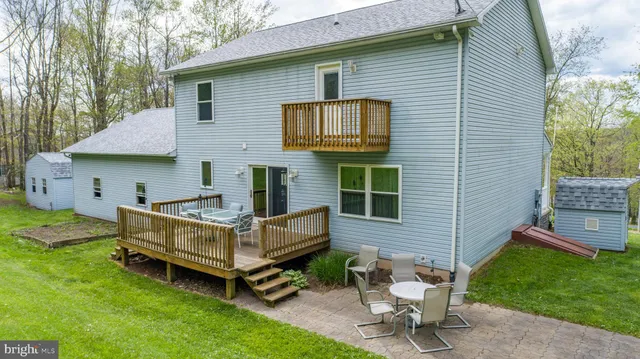 a view of a backyard with a sitting area