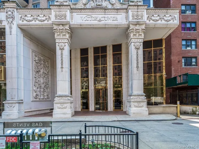 a front view of a building with glass windows and door