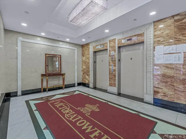 a view of a room with wooden floor and windows