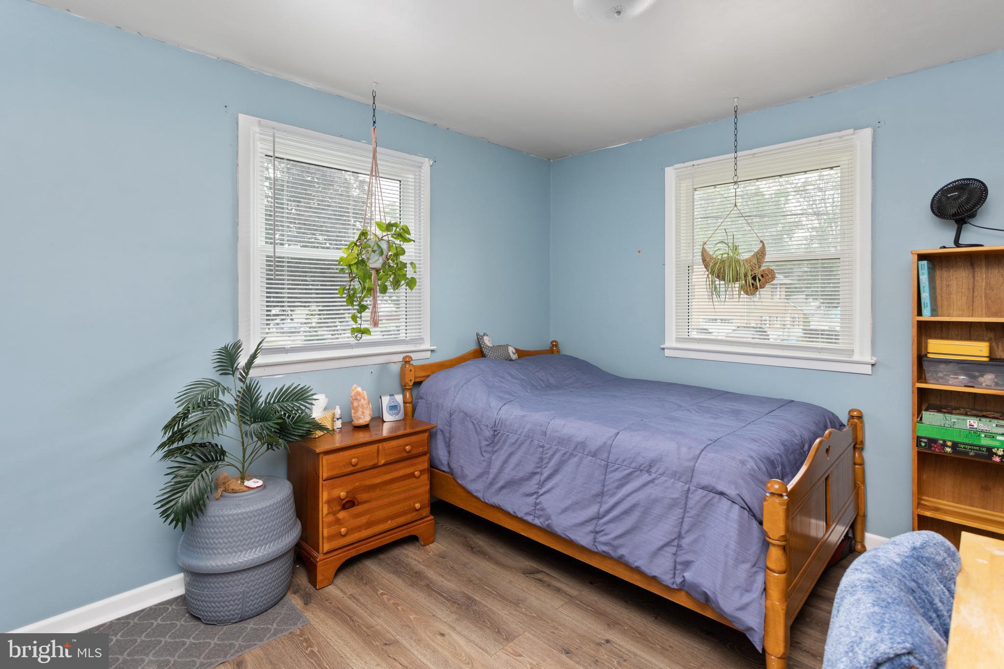 517 8 Street Riverside, NJ 08075 - Photo 16 of 29 a bed sitting in a bedroom next to a window