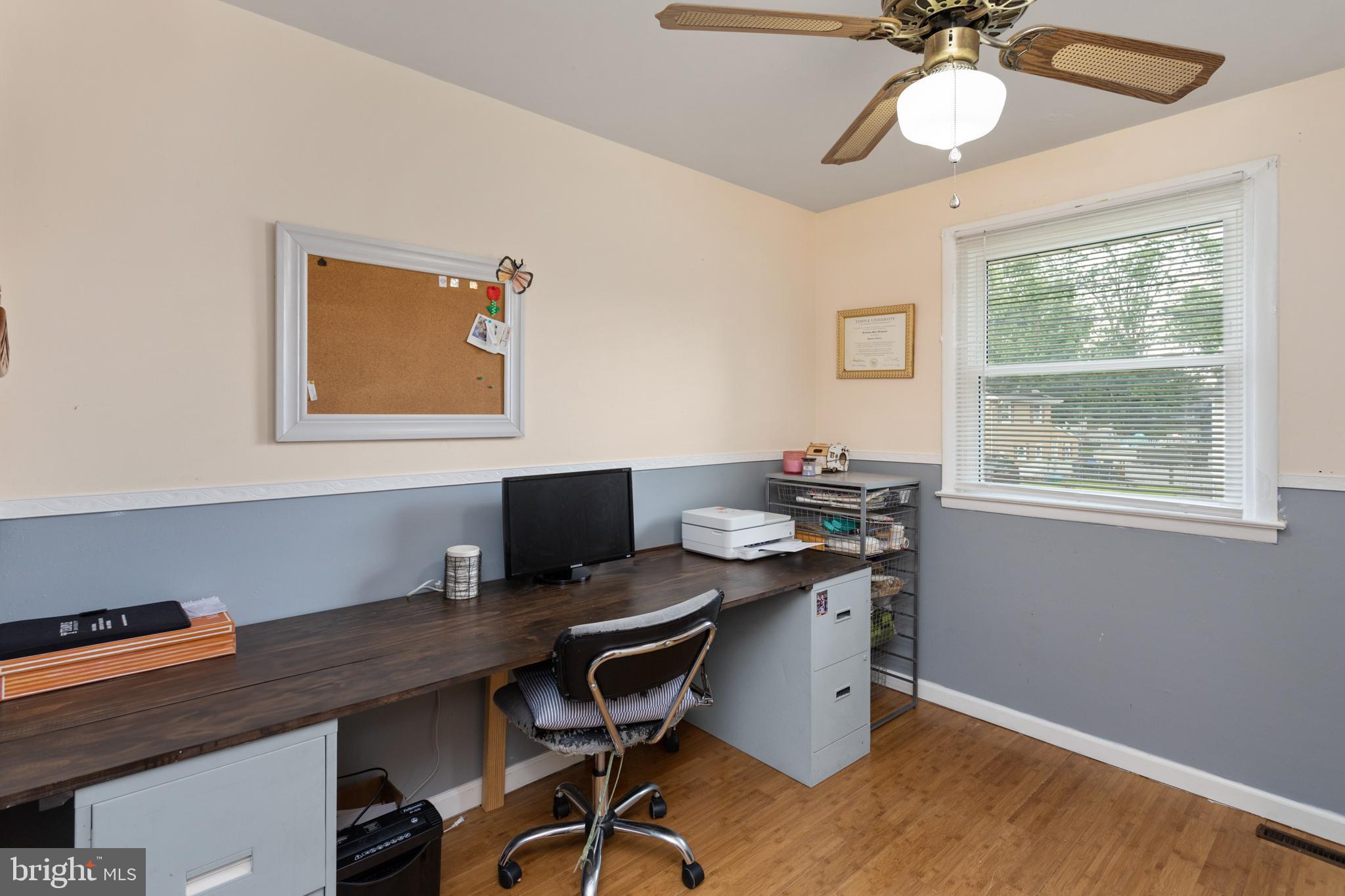 517 8 Street Riverside, NJ 08075 - Photo 18 of 29 a view of a workspace with furniture and a window