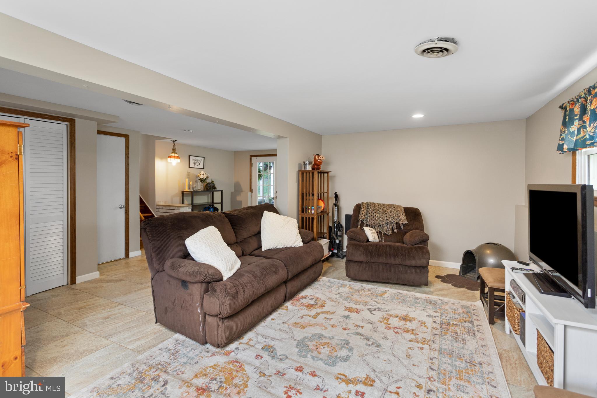 517 8 Street Riverside, NJ 08075 - Photo 23 of 29 a living room with furniture and a flat screen tv