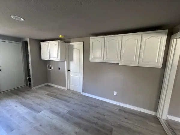 a kitchen with a sink and a stove top oven