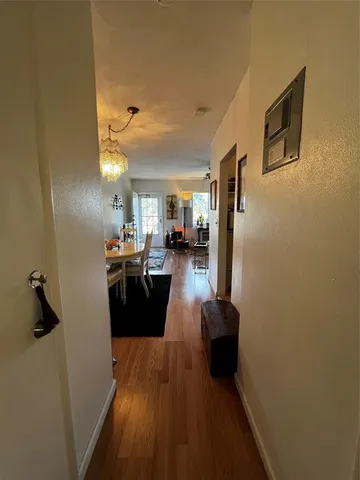 a view of a living room with a fireplace