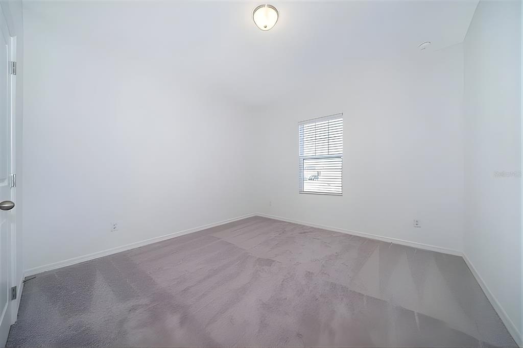 5844 Bovine Drive St. Cloud, FL 34771 - Photo 17 of 21 an empty room with windows