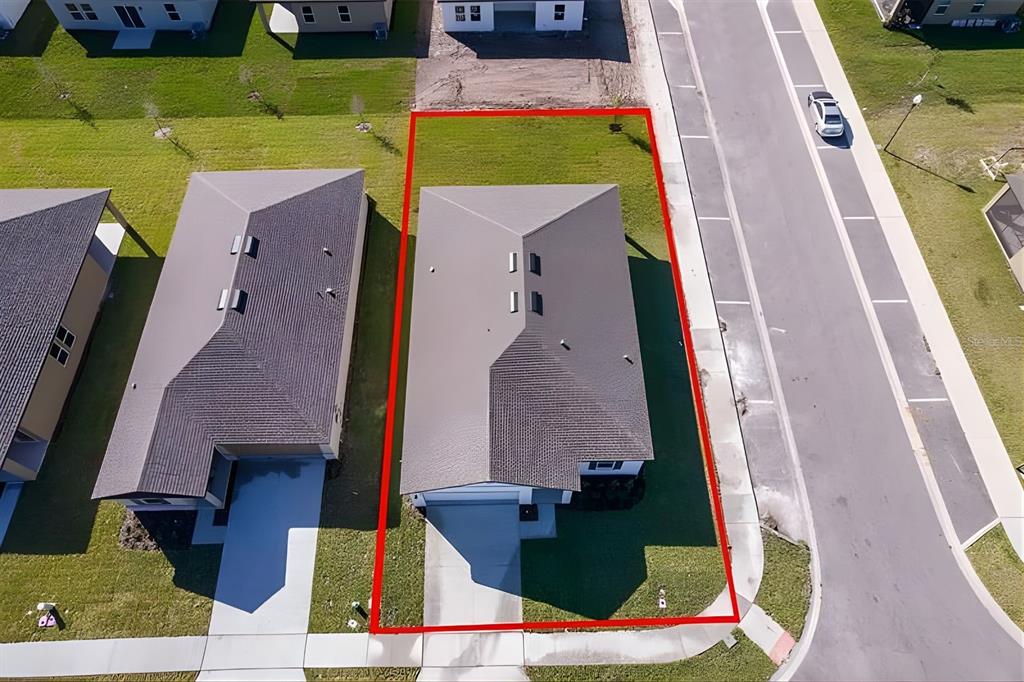 5844 Bovine Drive St. Cloud, FL 34771 - Photo 3 of 21 an aerial view of a house with a swimming pool