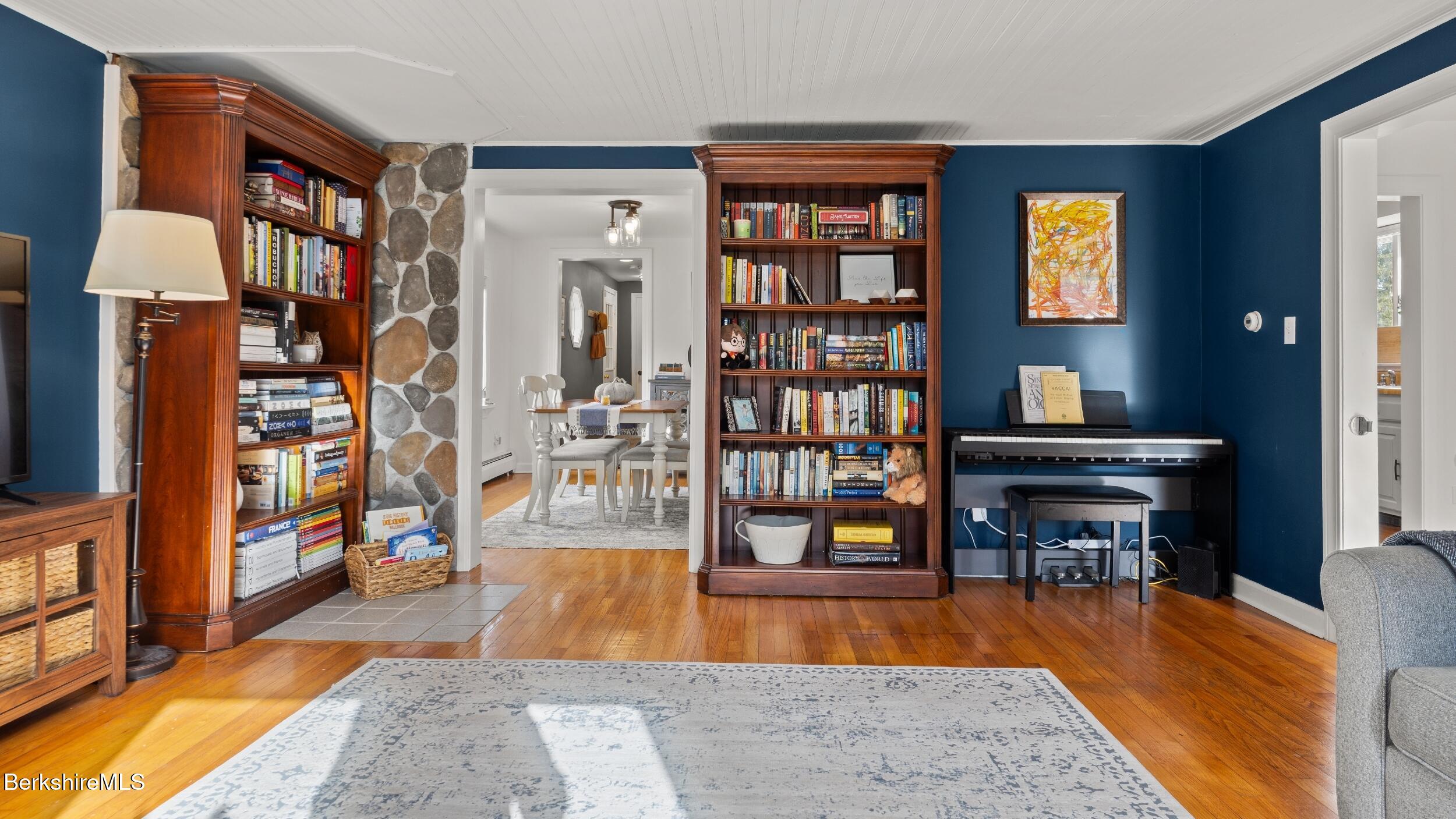 8 Catherine Street Lenox, MA 01242 - Photo 11 of 52 a room with lots of furniture and wooden floor