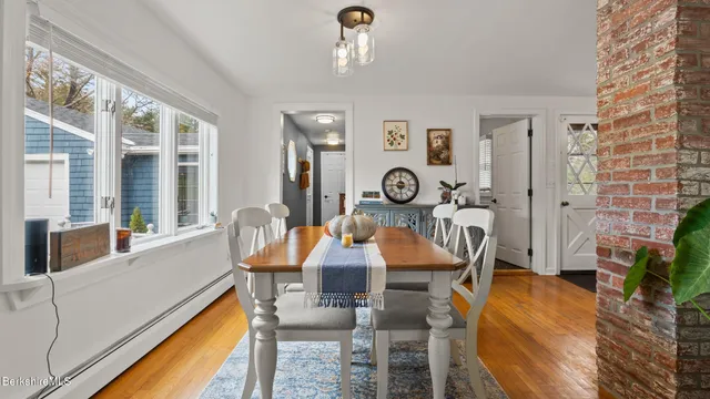 a view of a dining room with furniture window and outside view